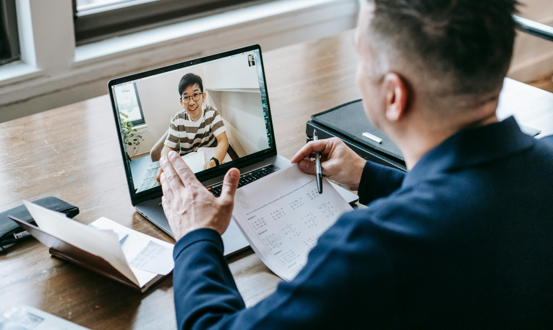 A financial advisor discussing with their client via a video call